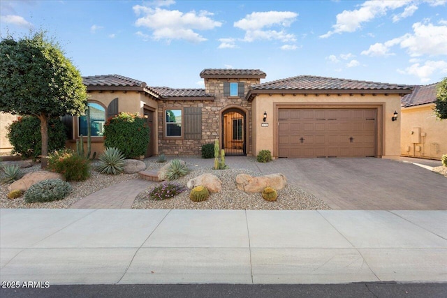 mediterranean / spanish-style house featuring a garage