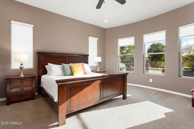 bedroom featuring light colored carpet and ceiling fan