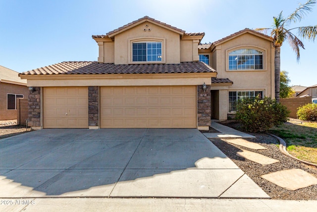 mediterranean / spanish-style home with a garage