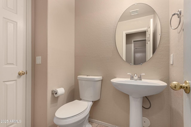 bathroom with sink and toilet