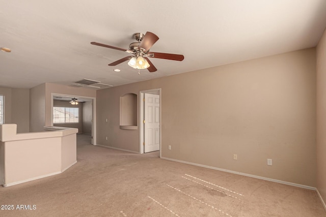 carpeted empty room with ceiling fan