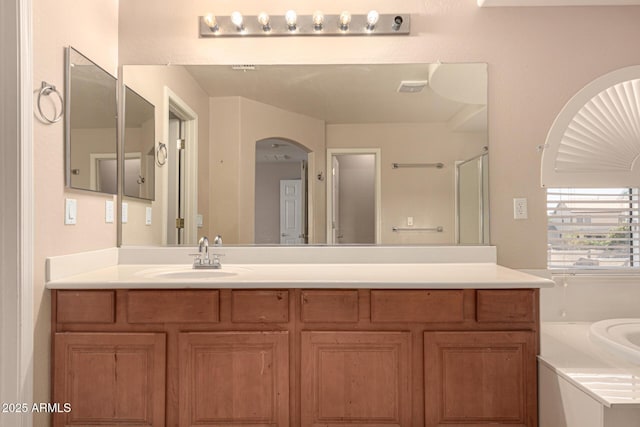 bathroom with vanity and an enclosed shower