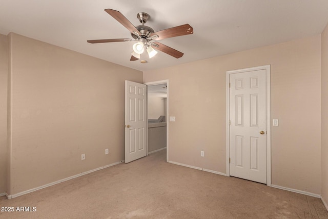 unfurnished bedroom with light carpet and ceiling fan