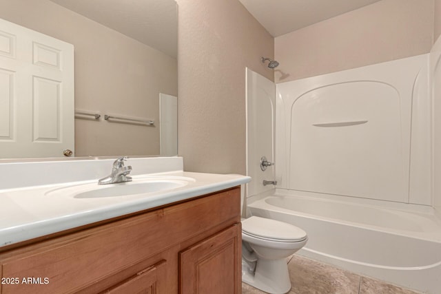 full bathroom with washtub / shower combination, vanity, toilet, and tile patterned flooring