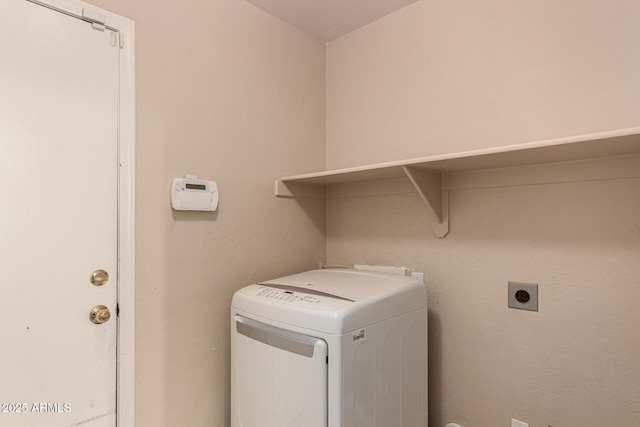 washroom with hookup for an electric dryer