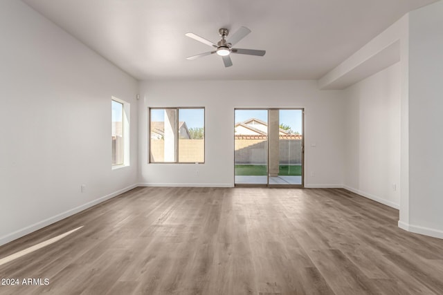 unfurnished room featuring ceiling fan and wood-type flooring