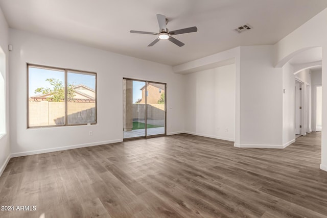 spare room featuring ceiling fan and hardwood / wood-style flooring