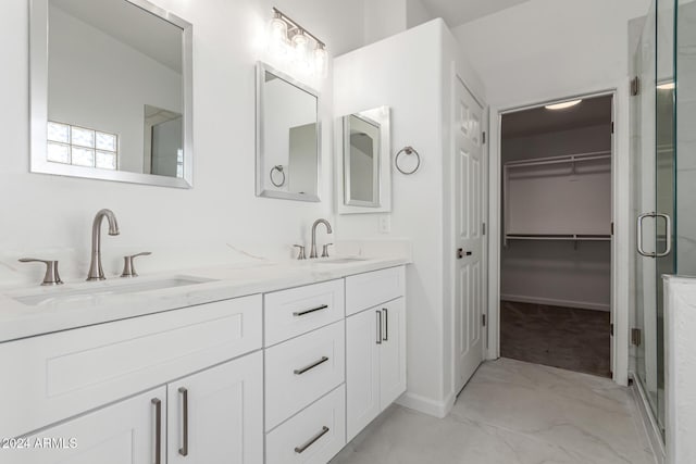 bathroom featuring vanity and an enclosed shower