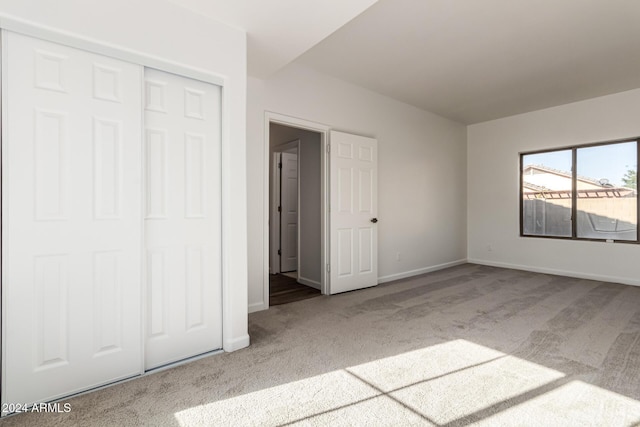 unfurnished bedroom with carpet and a closet