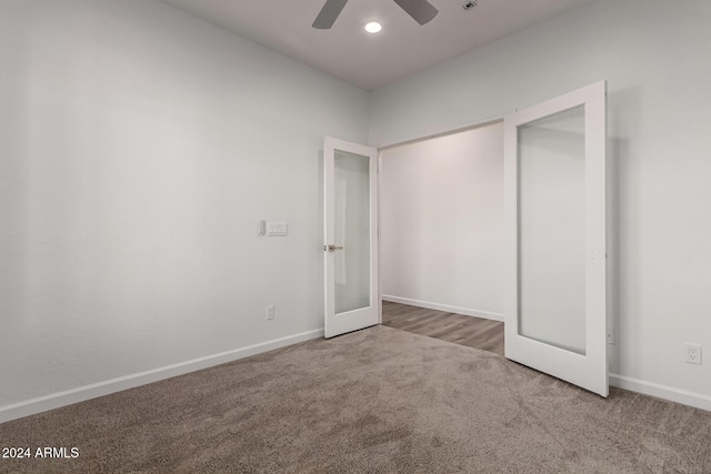 unfurnished bedroom featuring carpet flooring, ceiling fan, and french doors