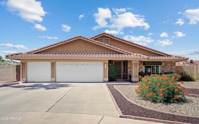 7726 W Cameron Dr, Peoria, AZ 85345 - single story home with a tile roof, a garage, and concrete driveway