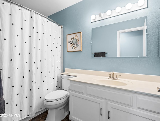 7726 W Cameron Dr, Peoria, AZ 85345 - bathroom featuring a shower with shower curtain, vanity, and toilet