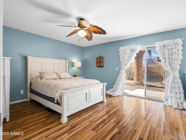 7726 W Cameron Dr, Peoria, AZ 85345 - bedroom featuring access to outside, baseboards, a ceiling fan, and wood finished floors