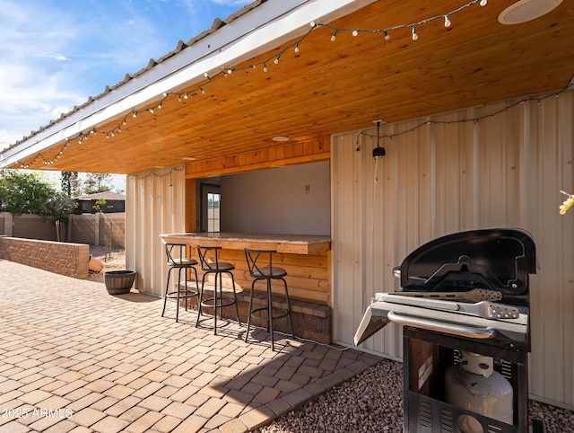 7726 W Cameron Dr, Peoria, AZ 85345 - view of patio featuring outdoor dry bar and fence