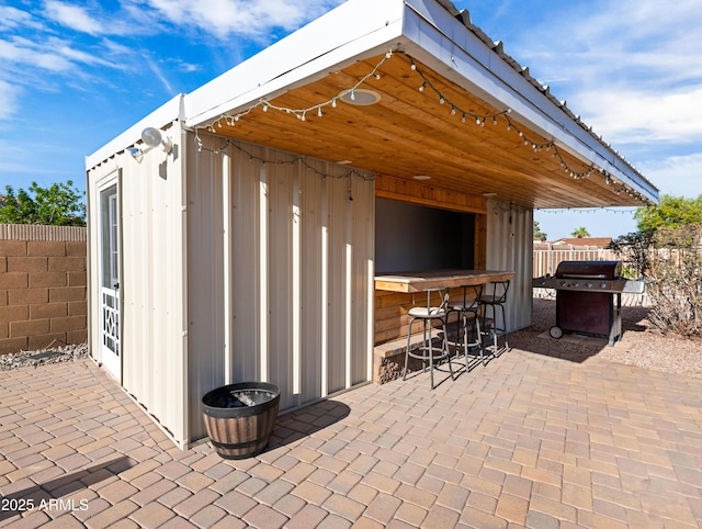 7726 W Cameron Dr, Peoria, AZ 85345 - view of patio / terrace featuring fence, outdoor dry bar, and area for grilling