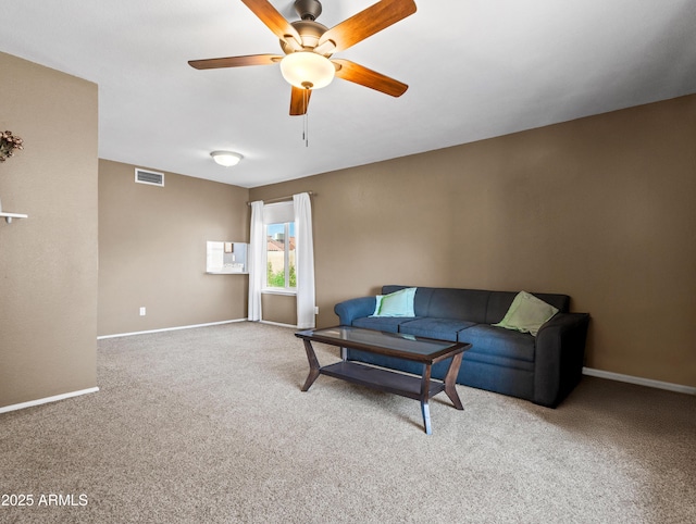 7726 W Cameron Dr, Peoria, AZ 85345 - living area with a ceiling fan, baseboards, carpet, and visible vents