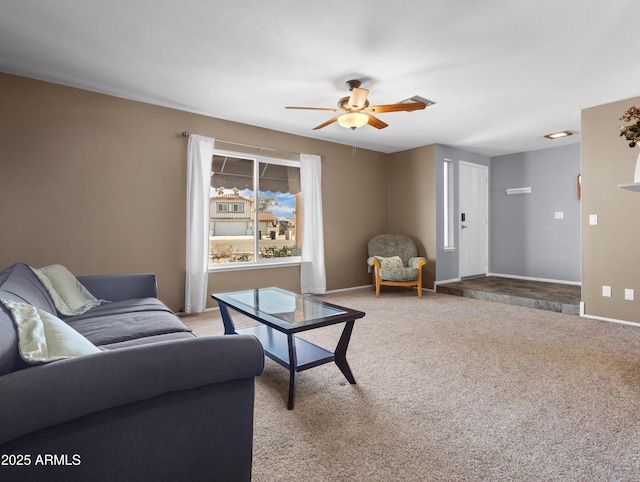 7726 W Cameron Dr, Peoria, AZ 85345 - living area featuring light colored carpet, baseboards, and ceiling fan