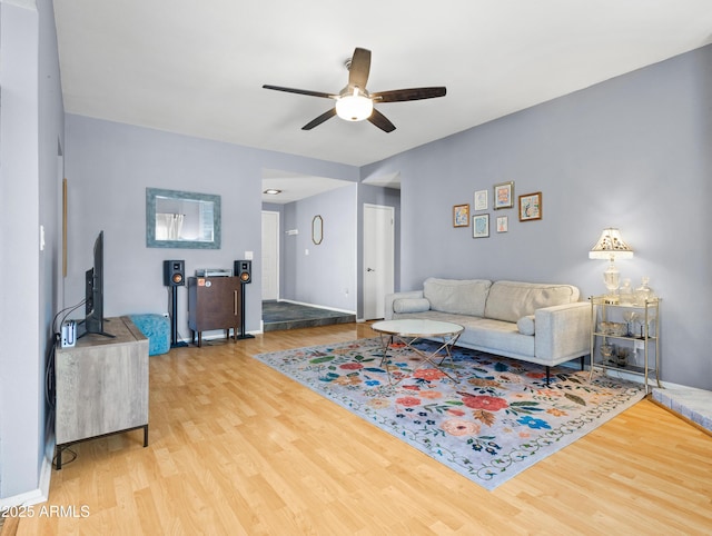 7726 W Cameron Dr, Peoria, AZ 85345 - living area featuring wood finished floors, ceiling fan, and baseboards