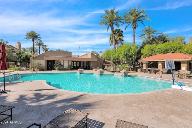 view of pool featuring a patio area and pool water feature