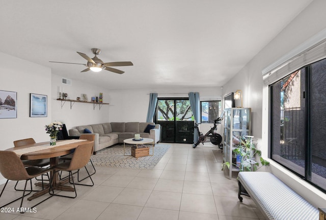 tiled living room featuring ceiling fan