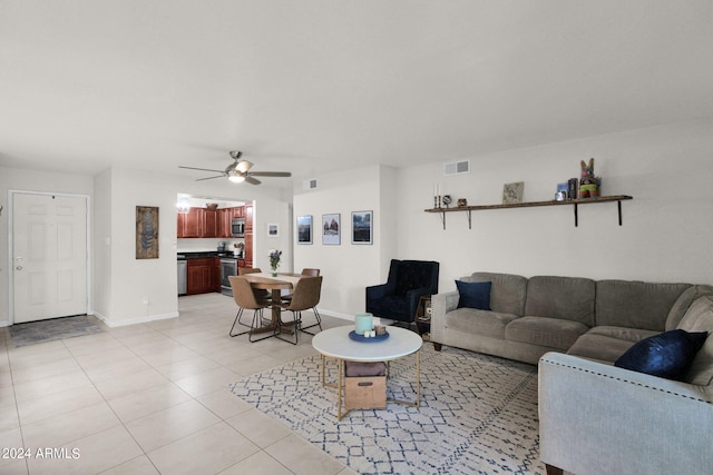 living room featuring ceiling fan and light tile patterned floors