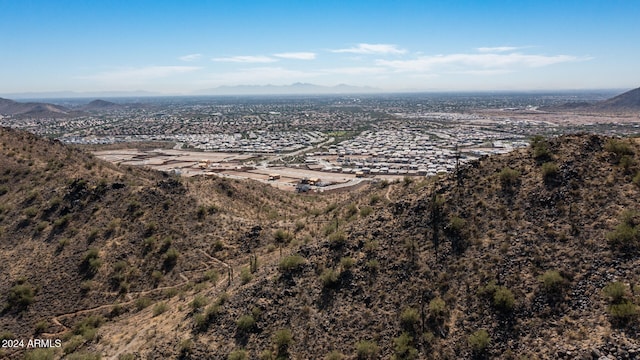 birds eye view of property featuring a mountain view