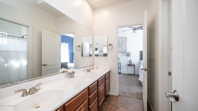 bathroom featuring vanity, ceiling fan, and tile patterned flooring