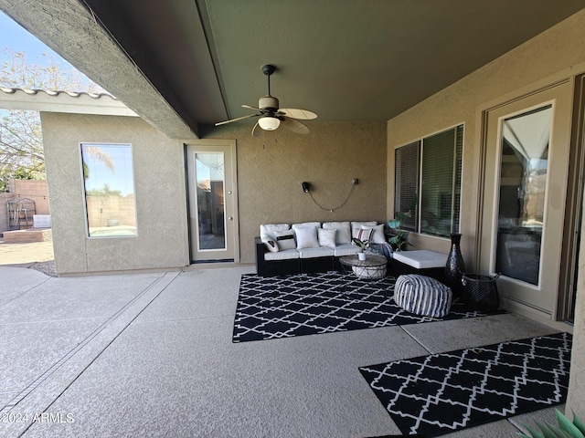 view of patio with outdoor lounge area and ceiling fan