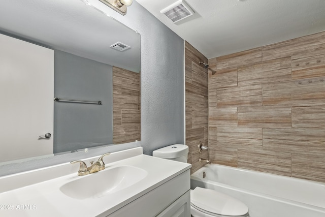 full bathroom with visible vents, shower / tub combination, toilet, and vanity