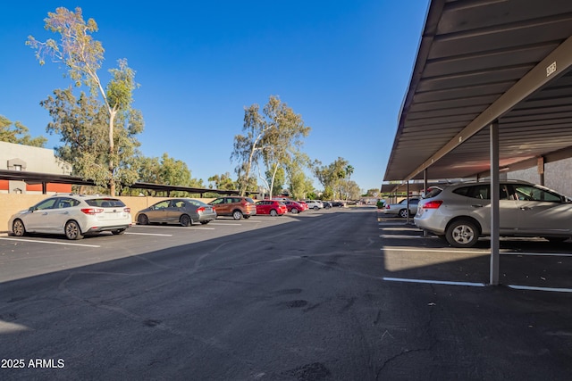 view of partially covered parking lot