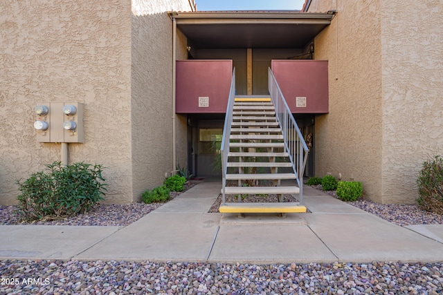 view of exterior entry with stucco siding