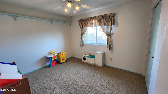 game room featuring carpet and ceiling fan