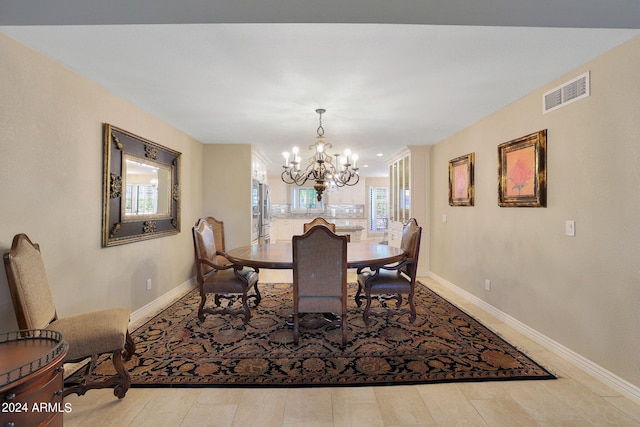 dining room featuring a notable chandelier