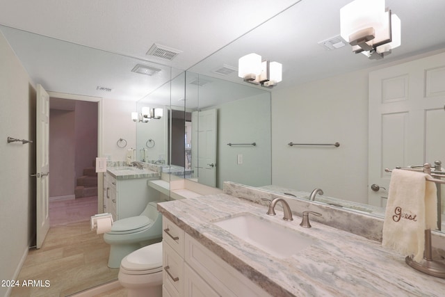 bathroom featuring vanity, wood-type flooring, a bidet, walk in shower, and toilet