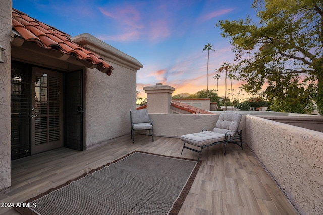 patio terrace at dusk with a balcony