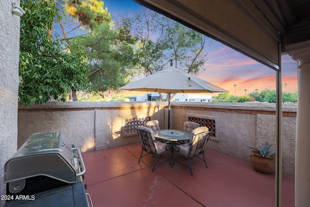 patio terrace at dusk with area for grilling