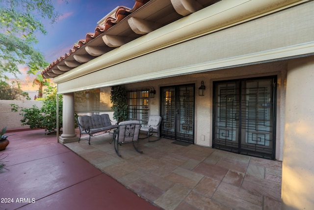 view of patio terrace at dusk