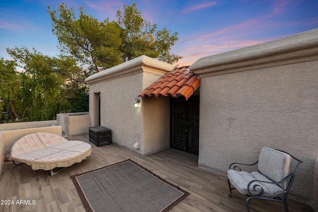 patio terrace at dusk with a wooden deck