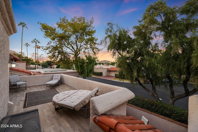 view of patio terrace at dusk