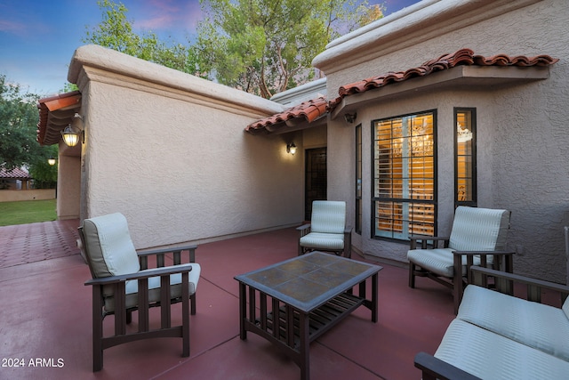 view of patio terrace at dusk