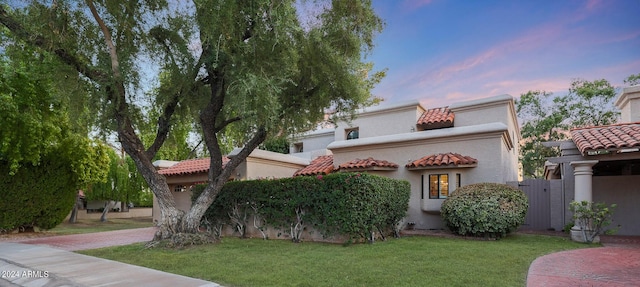 mediterranean / spanish-style house featuring a yard