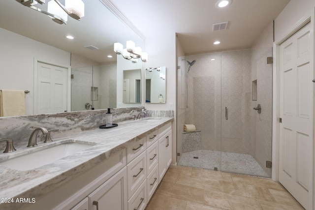 bathroom featuring walk in shower and vanity