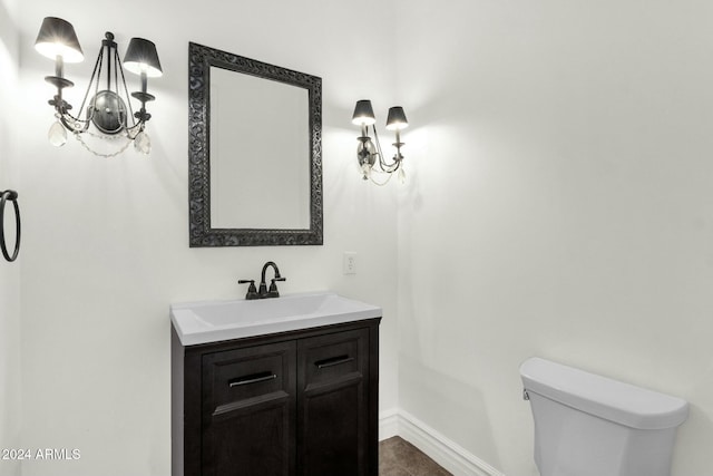 bathroom with tile patterned floors, vanity, and toilet