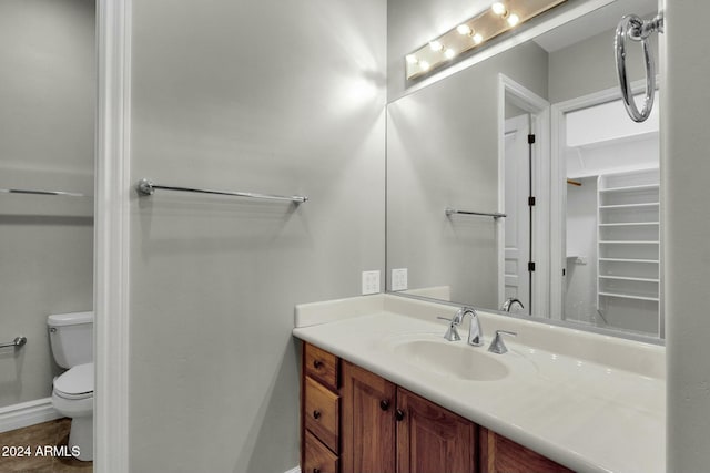 bathroom with vanity and toilet