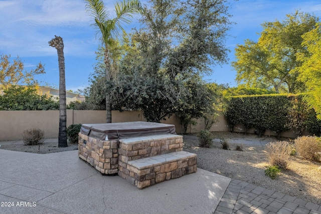 view of patio / terrace featuring a hot tub