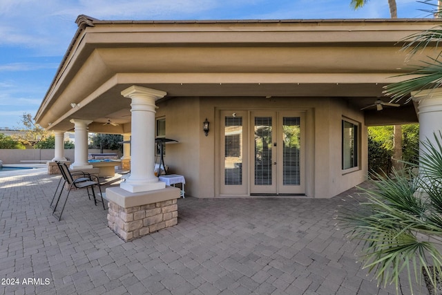 view of patio with french doors and ceiling fan