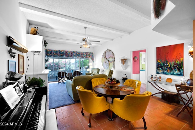 tiled dining space with ceiling fan, a textured ceiling, and beamed ceiling