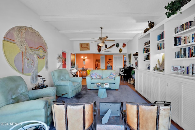 living room with beamed ceiling, ceiling fan, and built in shelves