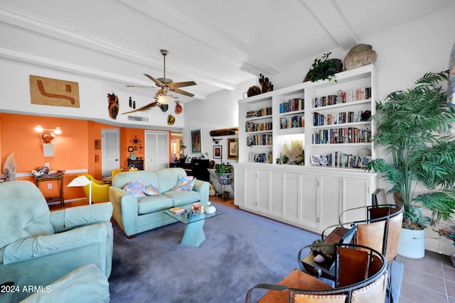 living room with ceiling fan and beam ceiling