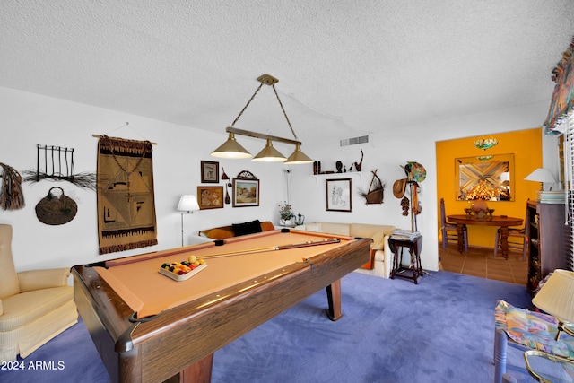 recreation room featuring carpet flooring, pool table, and a textured ceiling